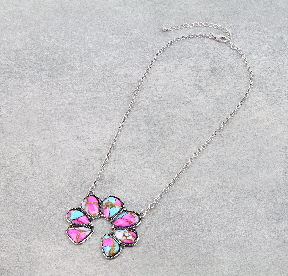 Necklace with pink mix stones on gray background