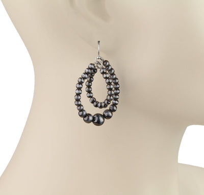 double teardrop earrings on a mannequin
