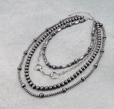 four strand silver bead necklace