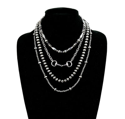 four strand silver bead necklace on bust