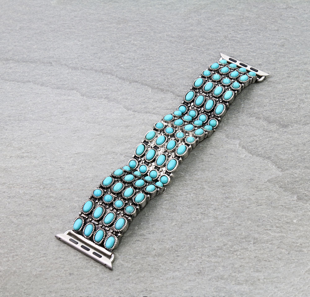 Turquoise watch band on a gray background