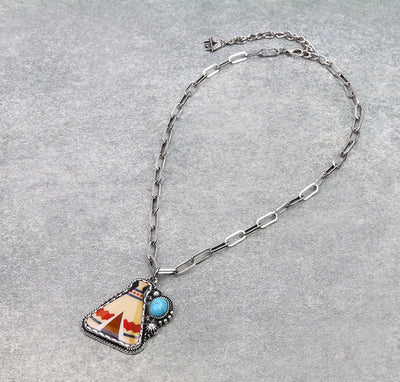 Necklace with a pendant featuring a Native American design on a gray background