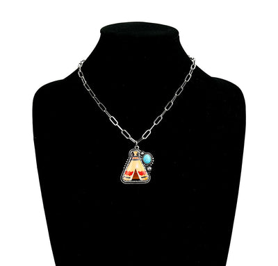 Necklace with a teepee pendant on a black mannequin bust.