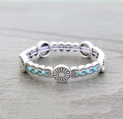 silver & turquoise stretch bracelet on a gray background