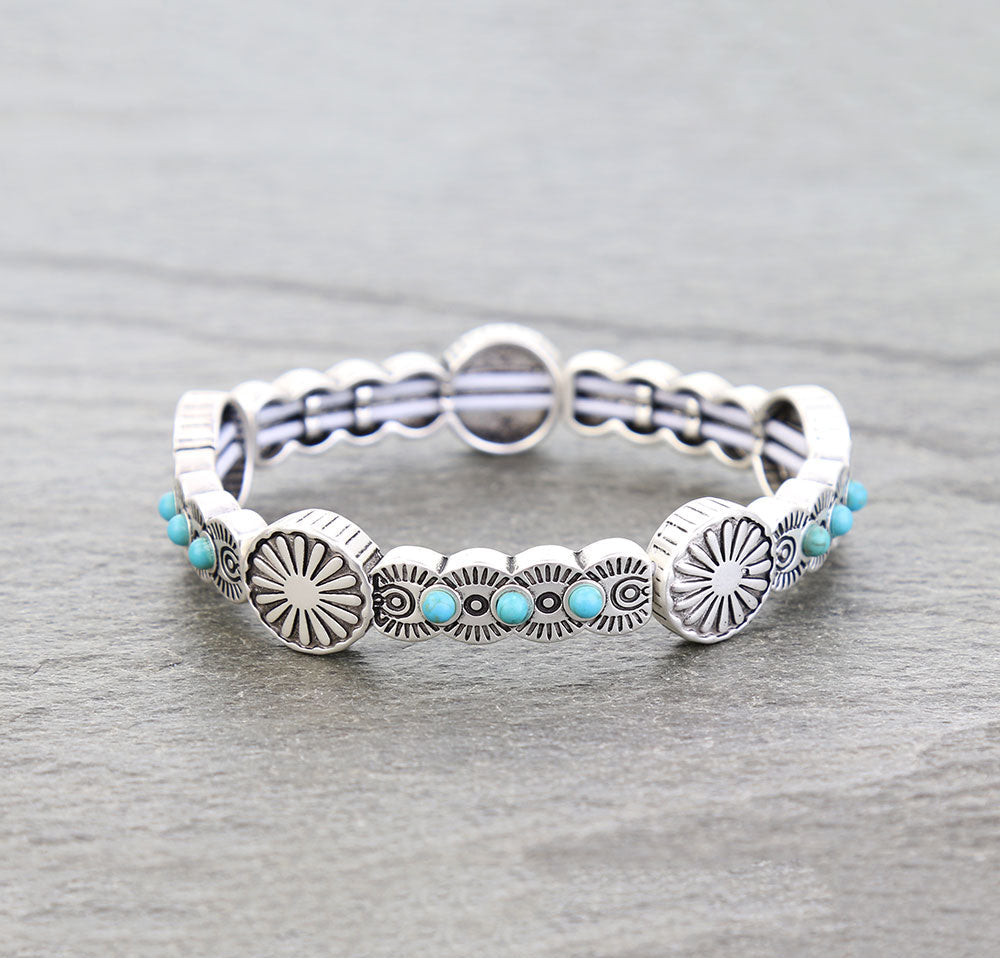silver & turquoise stretch bracelet on a gray background