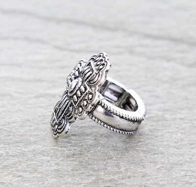 silver stretch cross ring on gray background