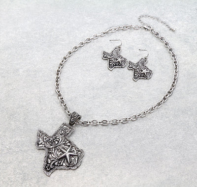silver texas necklace & fish hook earrings on a gray background