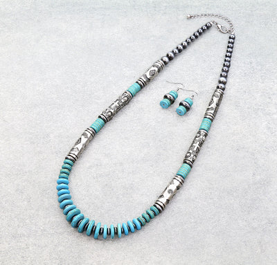 silver & turquoise necklace and earrings on a gray background