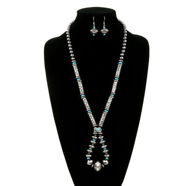 silver & turquoise loop necklace with coordinating earrings on a black jewelry bust