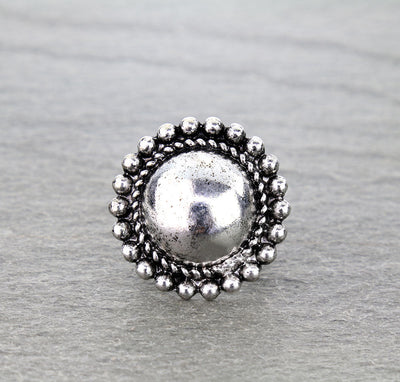 silver stretch ring on gray surface