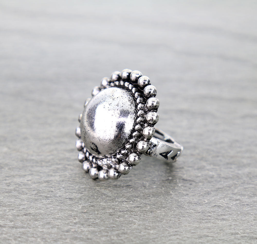 silver stretch ring on gray surface