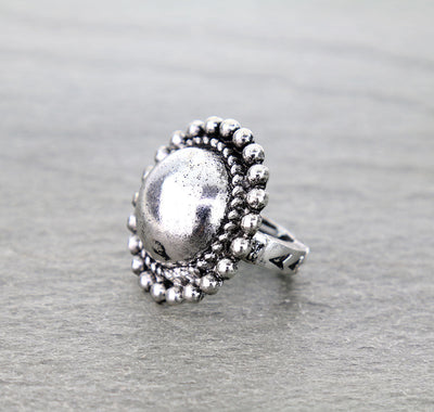 silver stretch ring on gray surface