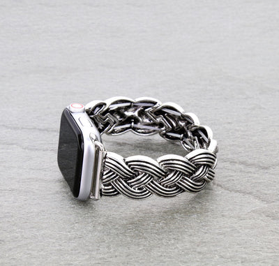 Silver braided watch band on a smartwatch against a gray background