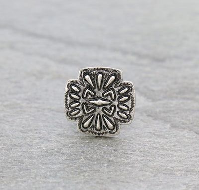 silver cross cuff ring on a gray background