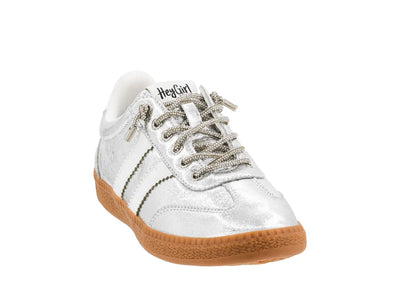 White sneaker with brown sole on a white background