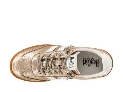 Gold sneaker with white sole on a white background
