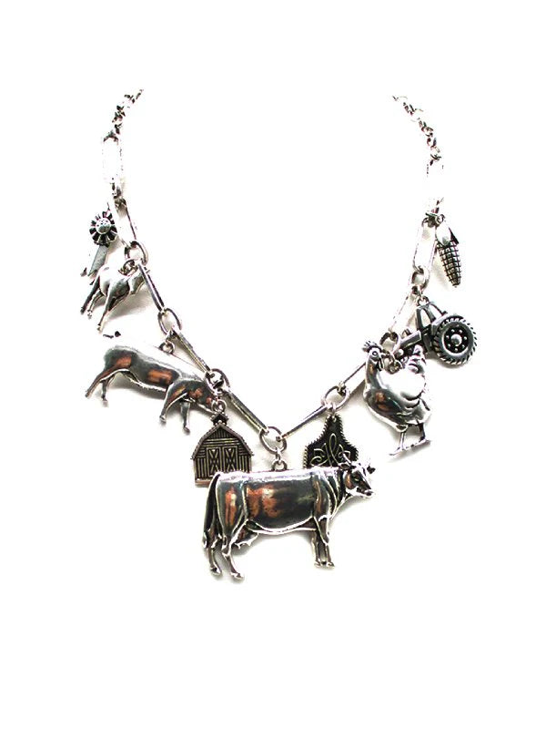 silver farm themed charm necklace on a white background