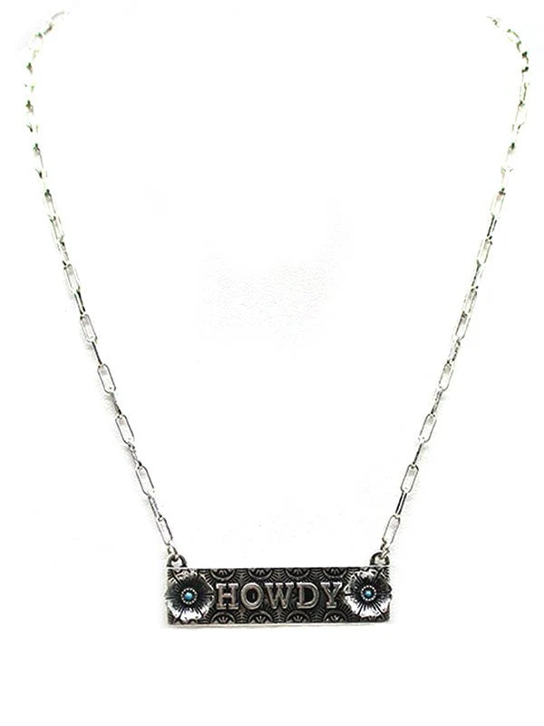 howdy bar necklace with flowers on a light background