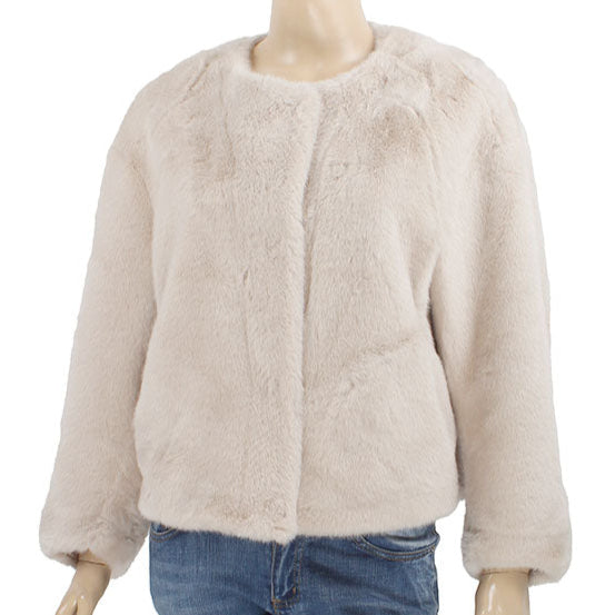 beige or ivory long sleeve jacket on a mannequin