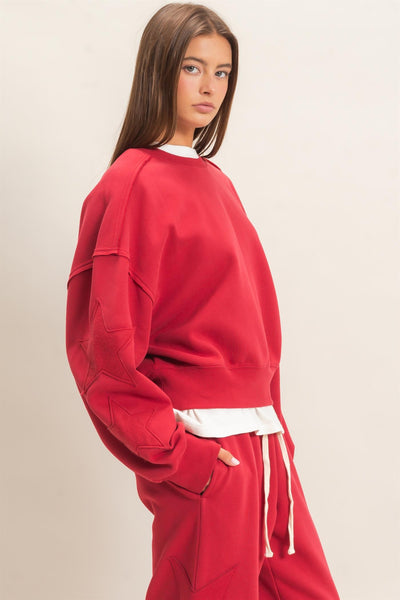 model wearing start patch sweatshirt and sweatpants
