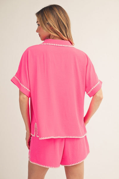 model wearing hot Pink top & shorts