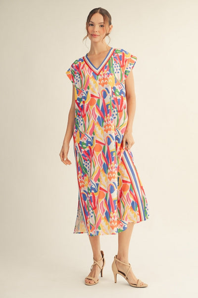 model wearing a multicolor print dress with stripes along the side  neckline