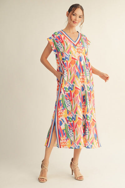 model wearing a multicolor print dress with stripes along the side  neckline