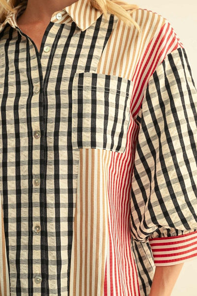 Close-up of a women's button-front shirt with mixed striped and check patterns. The shirt features black and beige gingham on the main body, vertical beige and brown stripes on the chest pocket area, and red and white stripes on the sleeves and pocket trim.