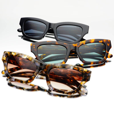 Three pairs of sunglasses with different designs and colors on a white background