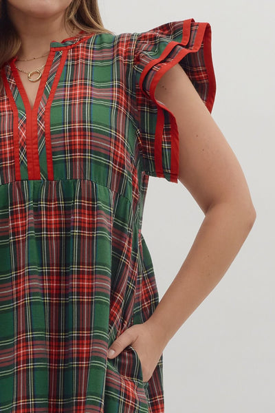 Plaid dress with red accents on a plain background