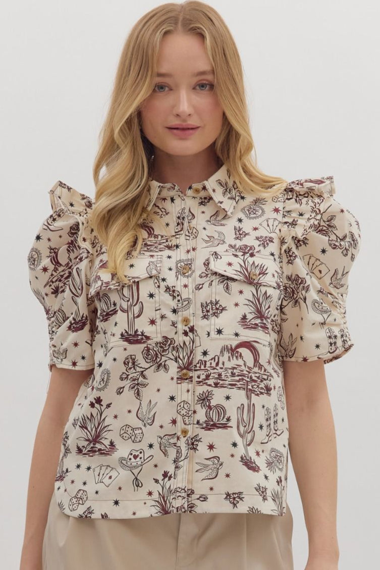 Woman wearing a patterned blouse and beige shorts on a white background