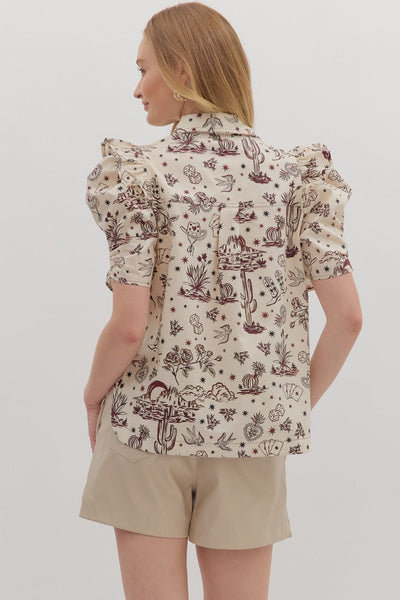 Woman wearing a patterned shirt and beige shorts on a white background