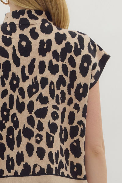 Leopard print sleeveless top worn by a person on a light background