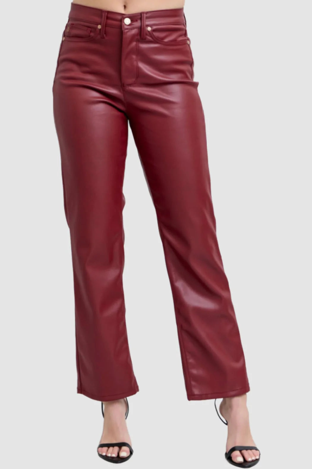 Maroon leather pants on a white background