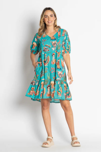 model wearing Mexican themed dress with an off white background