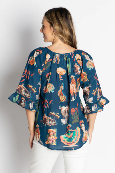 back view of navy Mexican top on a model with off white background